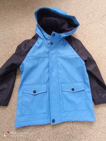 NEW.boy's rain jacket. Age 6/7