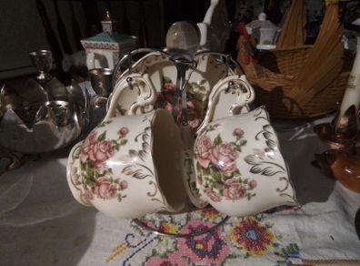 Two China Cups & Saucers with Spoons on a Stand