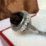 A beautiful silver ring with smokey quartz and white topaz. Image 5