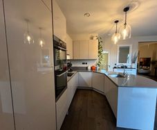 KUBE Modern High-Gloss Kitchen & AEG Appliances