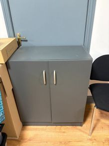 Desk with three drawer pedestal and cabinet