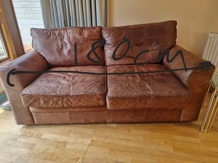 brown leather sofa and arm chair