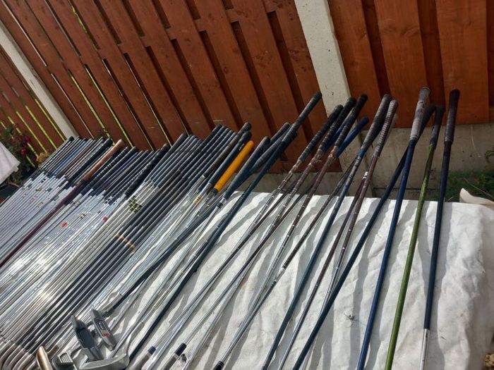 A selection of Golf clubs. Bags and golf balls.