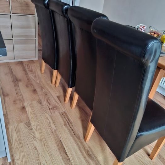 4 Black leather style kitchen chairs. Very few scuff marks 80