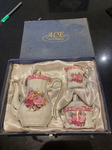 Vintage Porcelain small teapot sugar bowl and creamer set .       porcelain