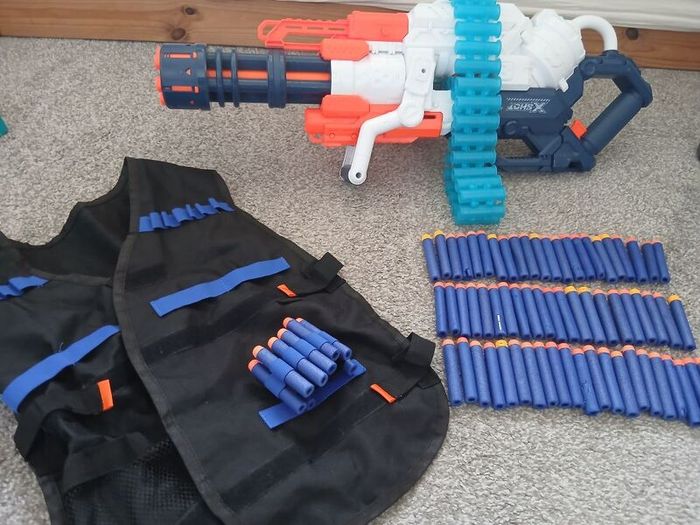 Nerf Gun extra large with bullets and gun vest to hold bullets.