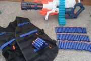 Nerf Gun extra large with bullets and gun vest to hold bullets.