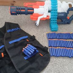 Nerf Gun extra large with bullets and gun vest to hold bullets.