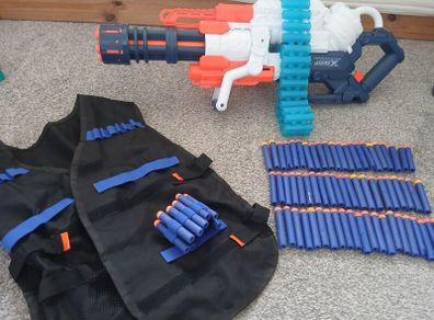 Nerf Gun extra large with bullets and gun vest to hold bullets.