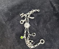 Thomas Sabo Charm Club wristwatch in sterling silver featuring a unique bracelet with 6 charms included