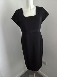 Never Worn. Flattering black dress from South. Size 14.