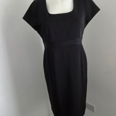 Never Worn. Flattering black dress from South. Size 14.