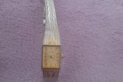 Gold plated ladies vintage citronella quartz wrist watch complete with safety chain