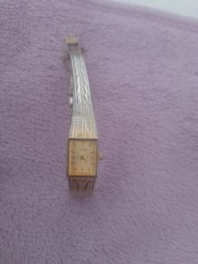 Gold plated ladies vintage citronella quartz wrist watch complete with safety chain