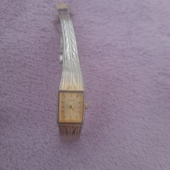 Gold plated ladies vintage citronella quartz wrist watch complete with safety chain