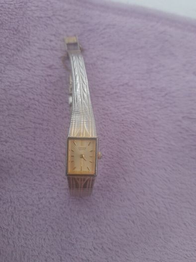 Gold plated ladies vintage citronella quartz wrist watch complete with safety chain