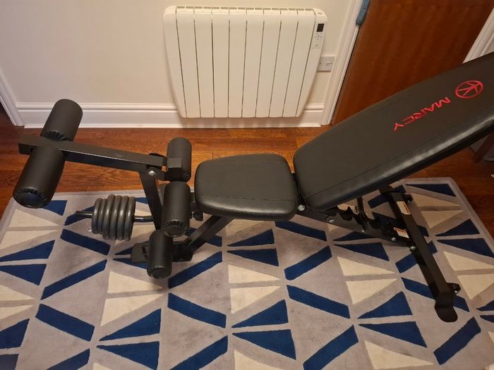 Weight bench with leg extensions