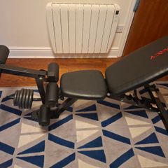 Weight bench with leg extensions