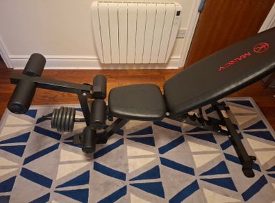 Weight bench with leg extensions