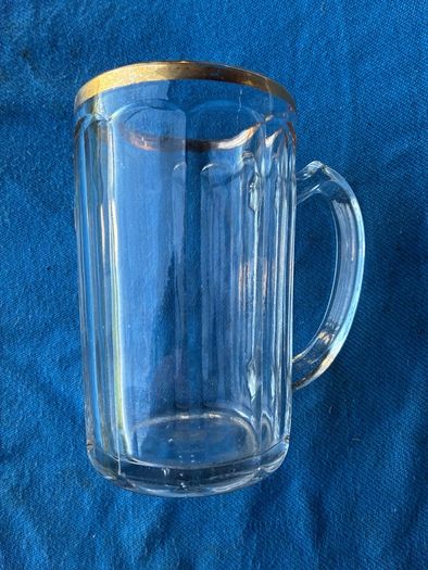Vintage pint glass in leather holder