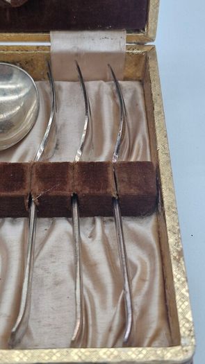 Cutlery set in a box .