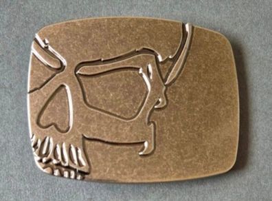 Belt buckle, skull design.