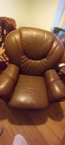 2 matching brown leather armchairs