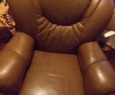 2 matching brown leather armchairs