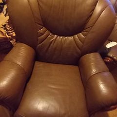 2 matching brown leather armchairs