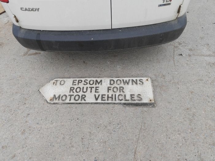 old aluminum road sign