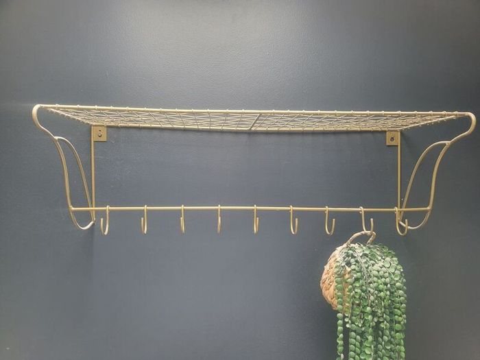 Danish interior design brass shelf with hooks