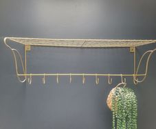 Danish interior design brass shelf with hooks