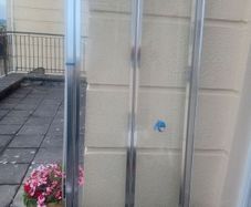 Bifold shower door