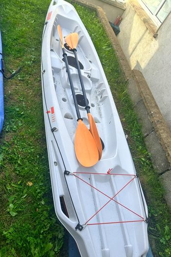 2+1 family sit on kayak