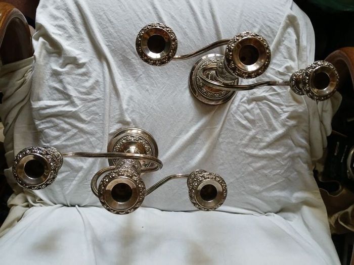 a matching pair of traditional three light candlelabras silver plated
