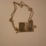 a lovely solid  silver locket and silver chain. in the shape of a book Image 2