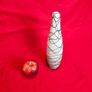 A decorative glass vase made of blown art glass, resembling a bottle in Murano style. Ornament Image 3
