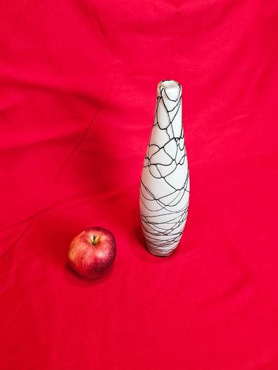 A decorative glass vase made of blown art glass, resembling a bottle in Murano style. Ornament