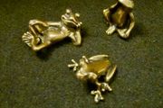 3 brass frogs.