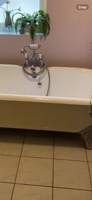 Claw legged roll top cast iron bath