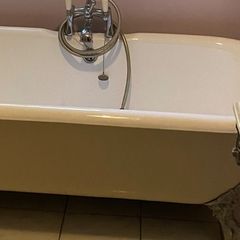 Claw legged roll top cast iron bath