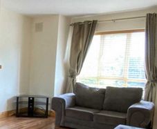 Grey 2-seater Sofa - ideal for a living room Collection only in Co. Tipperary
