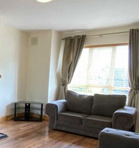Grey 2-seater Sofa - ideal for a living room Collection only in Co. Tipperary