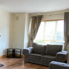 Grey 2-seater Sofa - ideal for a living room Collection only in Co. Tipperary