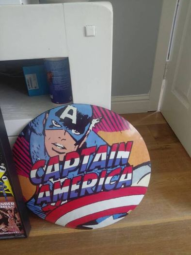 large wooden framed super heroes and villans wall hanging and 2 metal wallhanging discs