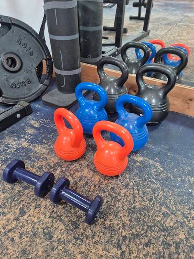 Home Gym set up w/ plates and kettlebells