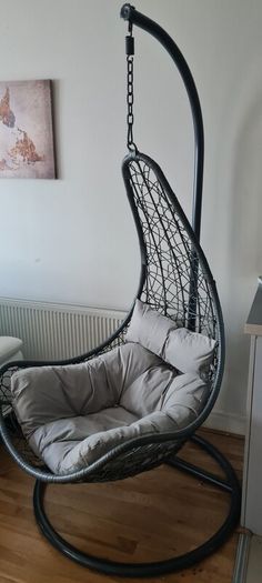 egg chair, original outdoor grey cushion. Including extra cushions & throw. Used indoors. Will include large and small cushion and fake throw