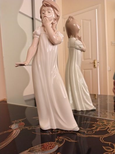 Nao by Lladro.  Yawning Girl. Damaged.