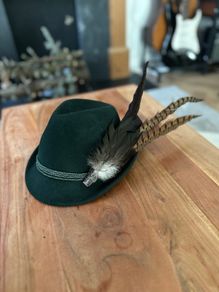 Green hat with feathers