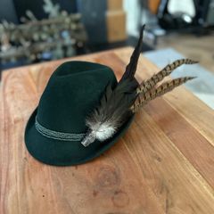 Green hat with feathers